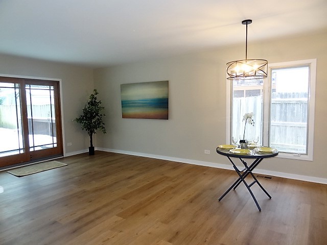 21 Buckingham Road Glen Ellyn, IL 60137 - Photo 13 of 38 a view of a room with wooden floor and windows