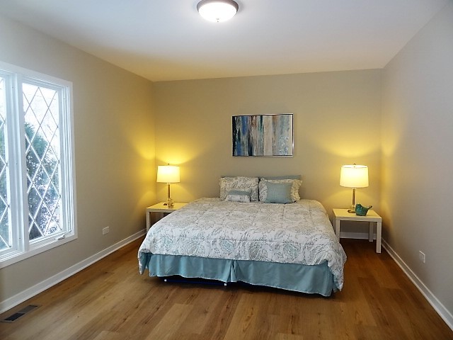 21 Buckingham Road Glen Ellyn, IL 60137 - Photo 22 of 38 a bedroom with a bed and night stand