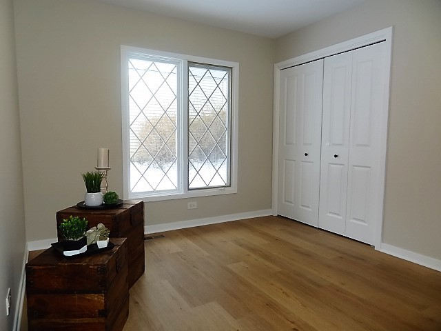 21 Buckingham Road Glen Ellyn, IL 60137 - Photo 28 of 38 a view of room with workspace window and wooden floor