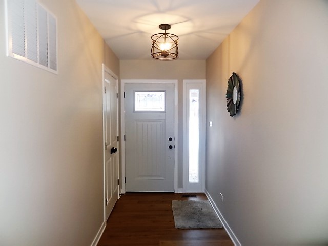 21 Buckingham Road Glen Ellyn, IL 60137 - Photo 3 of 38 a view of a hallway with wooden floor and a window