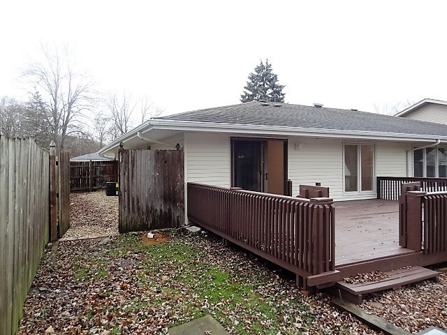 21 Buckingham Road Glen Ellyn, IL 60137 - Photo 36 of 38 a view of a house with a small yard and wooden fence