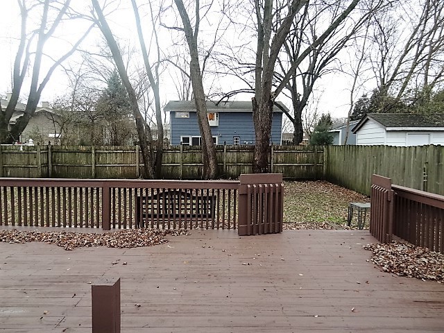 21 Buckingham Road Glen Ellyn, IL 60137 - Photo 37 of 38 a view of a wooden fence next to a lake
