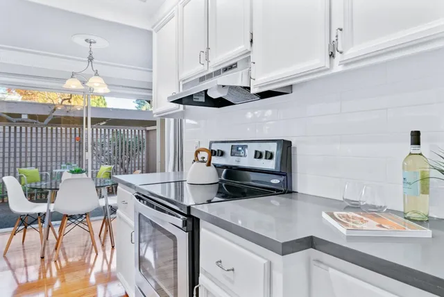 a kitchen that has a lot of cabinets in it