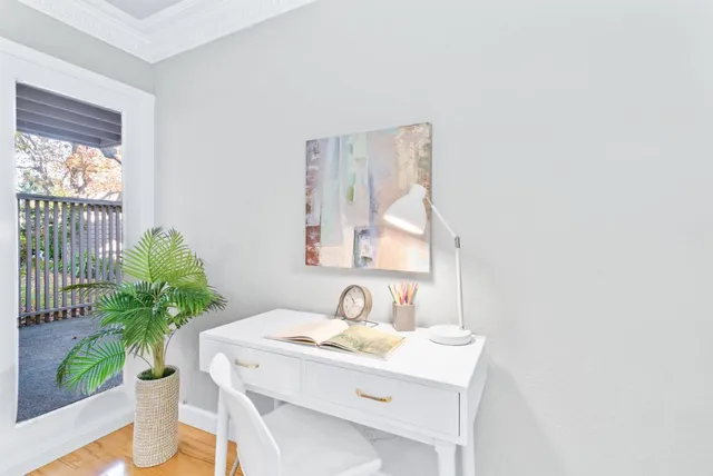 a view of bathroom with a sink and mirror