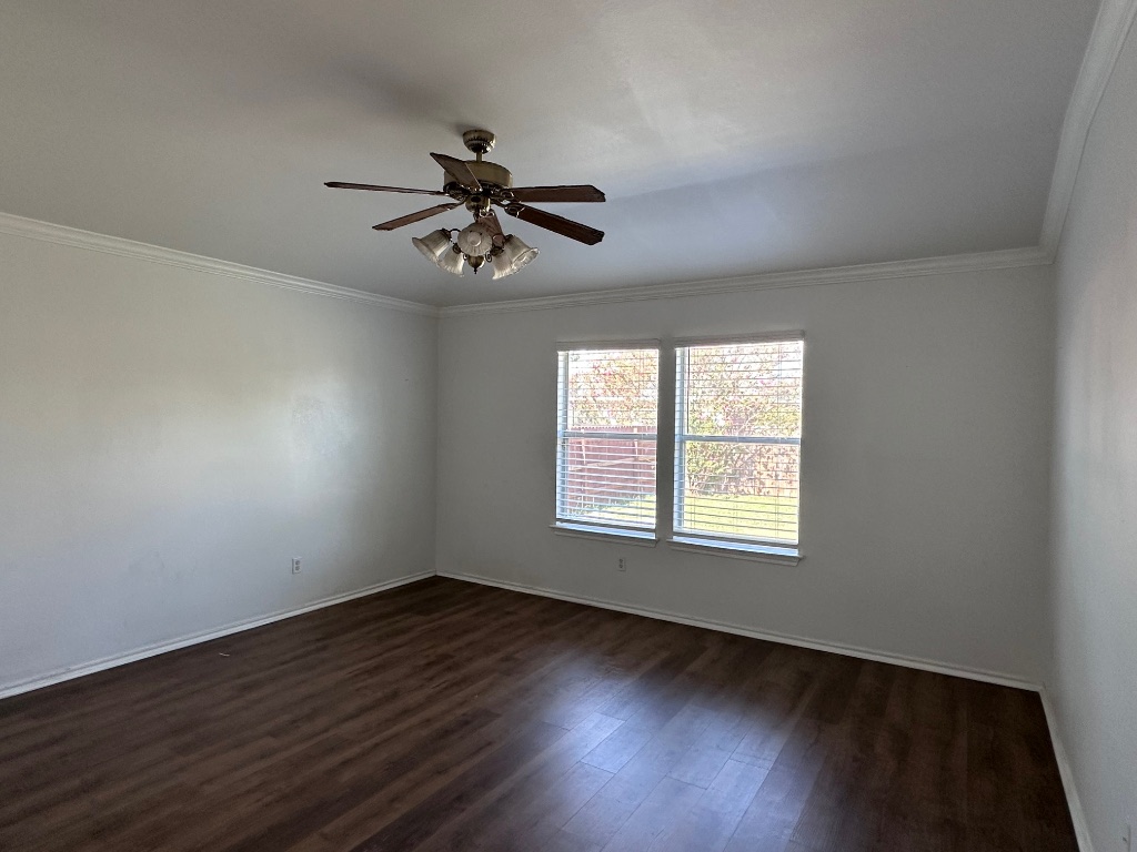 12720 Waynespur Lane Elgin, TX 78621 - Photo 24 of 31 a view of an empty room with wooden floor and a window