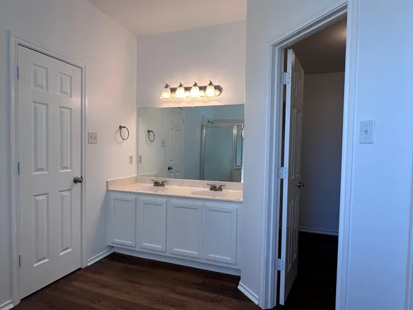 a bathroom with a sink and mirror