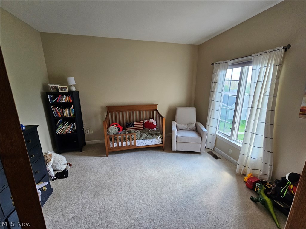 2363 Tabor Ridge Road Northeast New Philadelphia, OH 44663 - Photo 32 of 42 Bright room with neutral wall tones and light carpet flooring