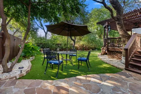 a large kitchen with a table and chairs