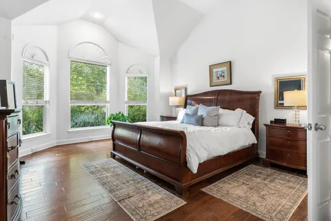 a view of table and chairs under an umbrella