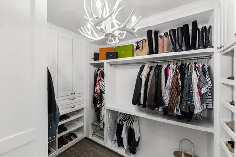 a bathroom with a shower sink vanity and mirror