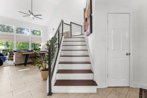 a kitchen with a sink a stove top oven and cabinets