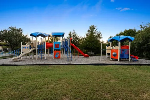 a view of a house with pool table and chairs