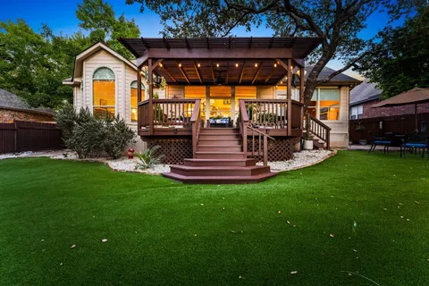 a spacious bathroom with a granite countertop sink and a mirror