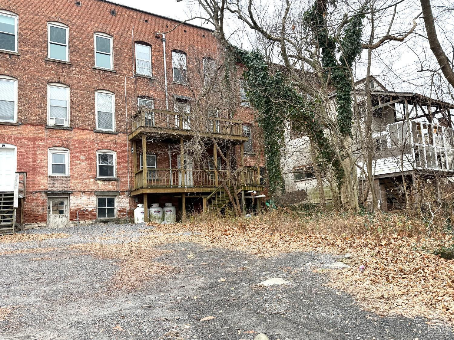 283 Main Street Catskill, NY 12414 - Photo 23 of 25 a front view of a building with large trees
