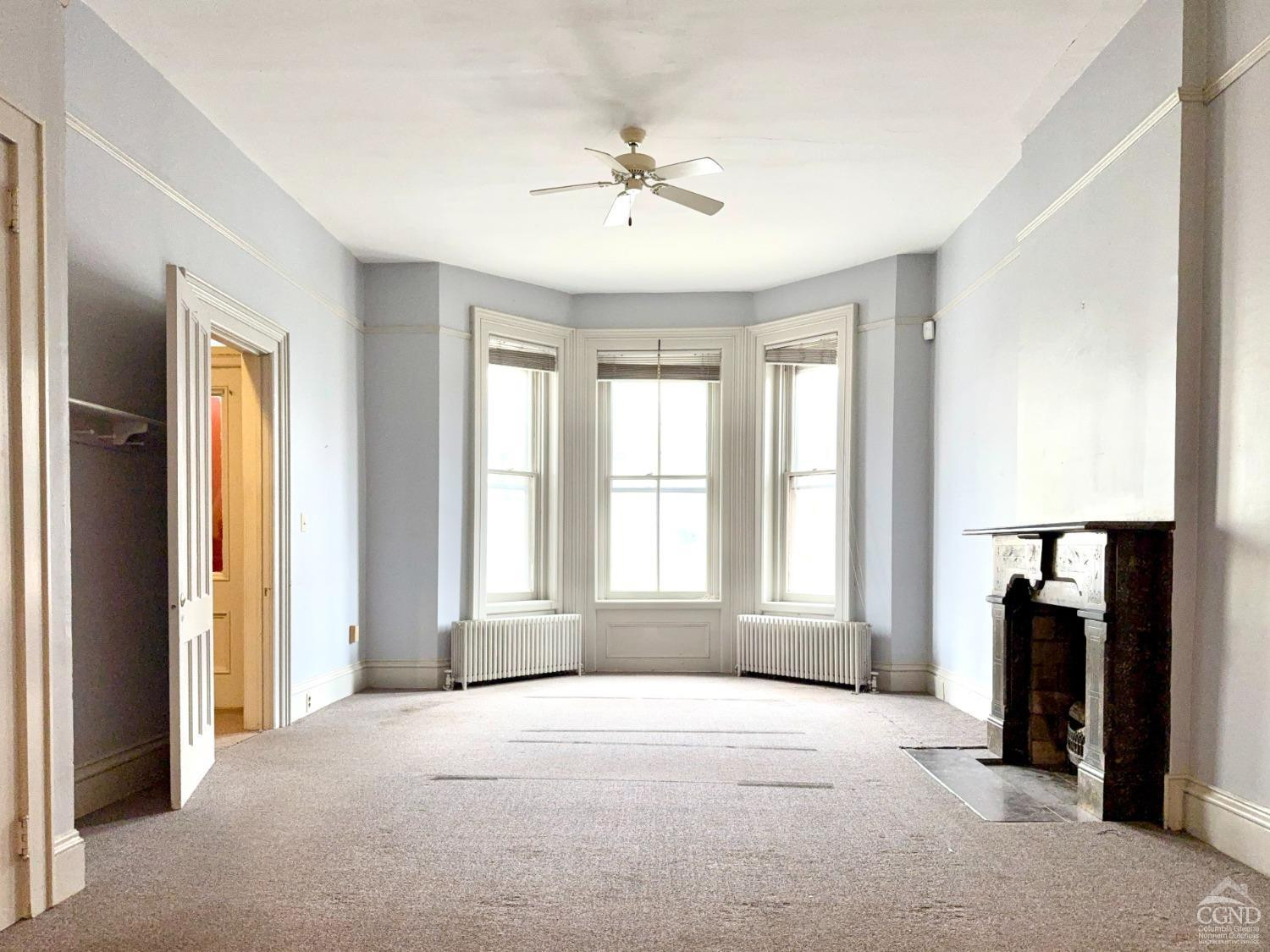 283 Main Street Catskill, NY 12414 - Photo 3 of 25 a view of an empty room with a window