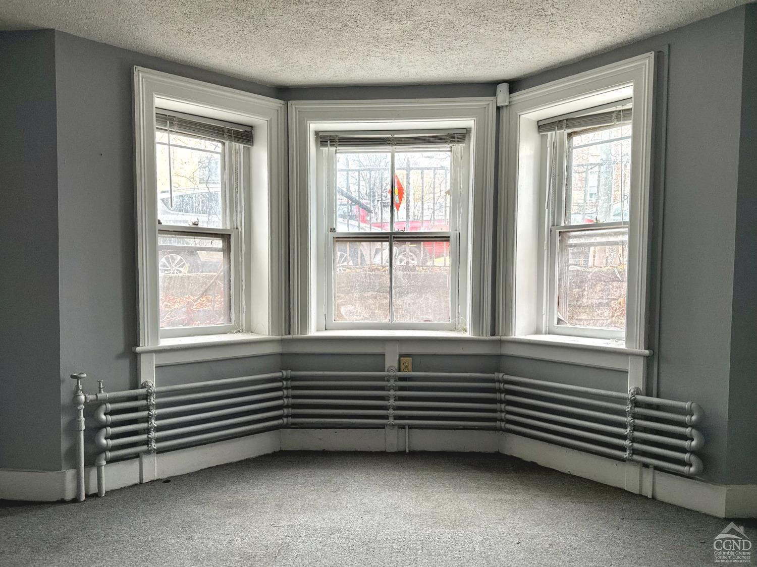 283 Main Street Catskill, NY 12414 - Photo 8 of 25 a view of an empty room with windows