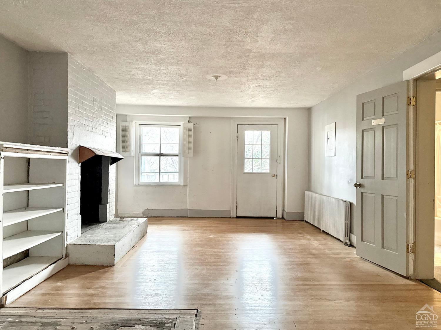 283 Main Street Catskill, NY 12414 - Photo 9 of 25 a view of livingroom with hardwood floor and window