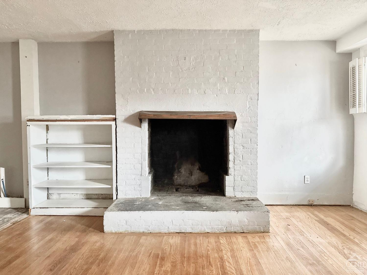 283 Main Street Catskill, NY 12414 - Photo 10 of 25 a living room with a fireplace