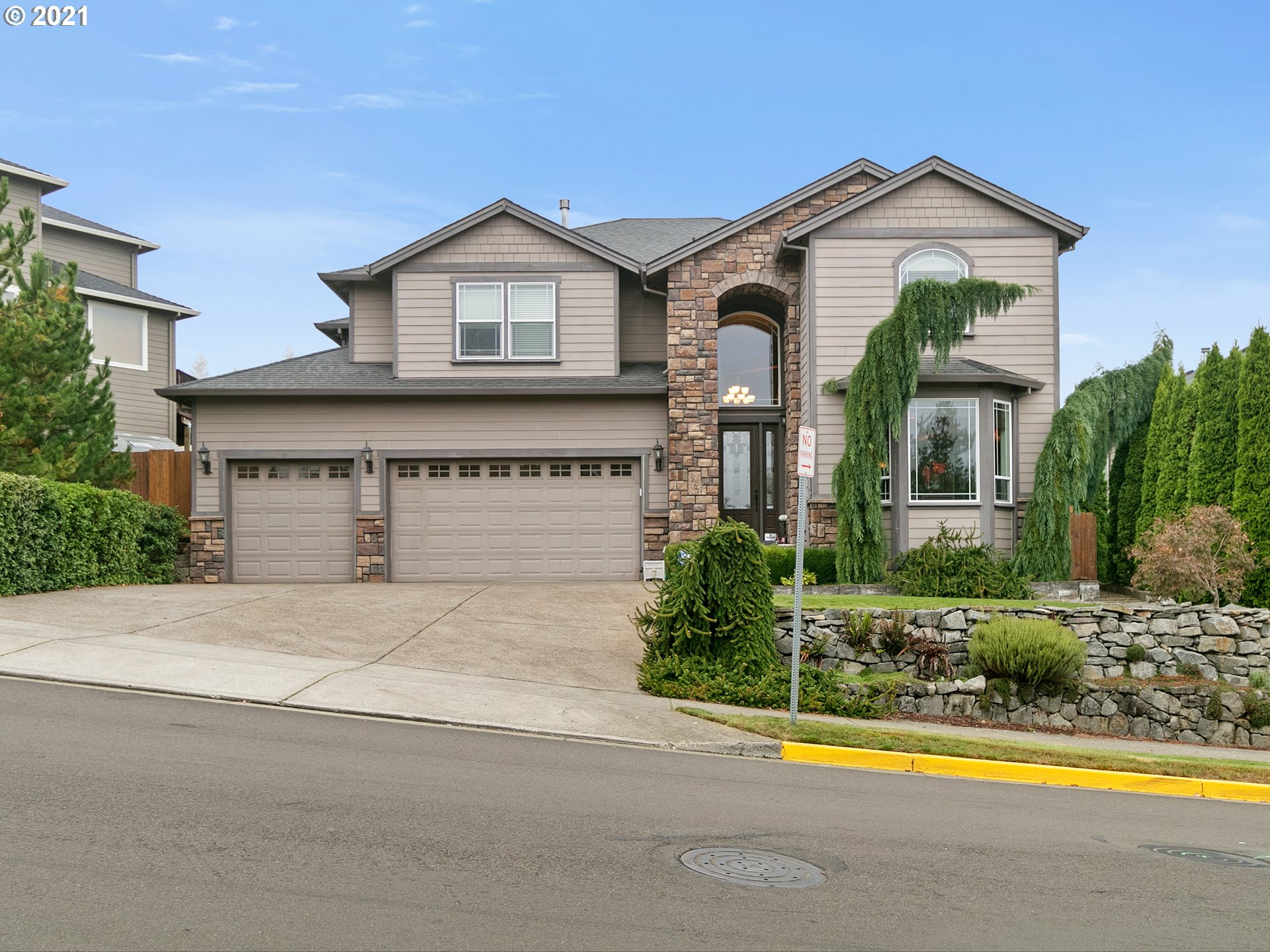14741 Southeast Badger Creek Road Happy Valley, OR 97086 - Photo 1 of 32 front view of a house with a small yard