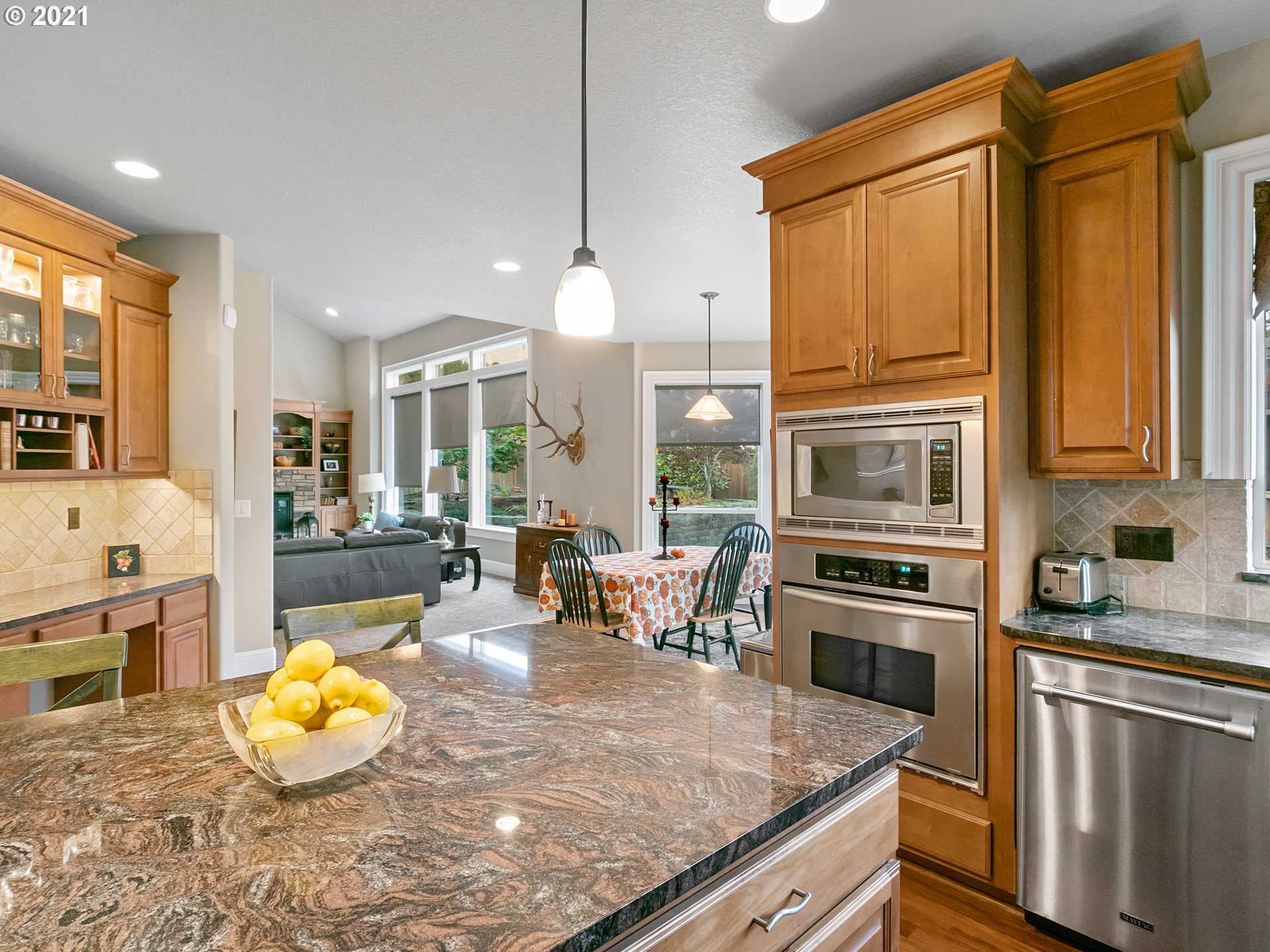 14741 Southeast Badger Creek Road Happy Valley, OR 97086 - Photo 13 of 32 a kitchen with sink refrigerator and stove