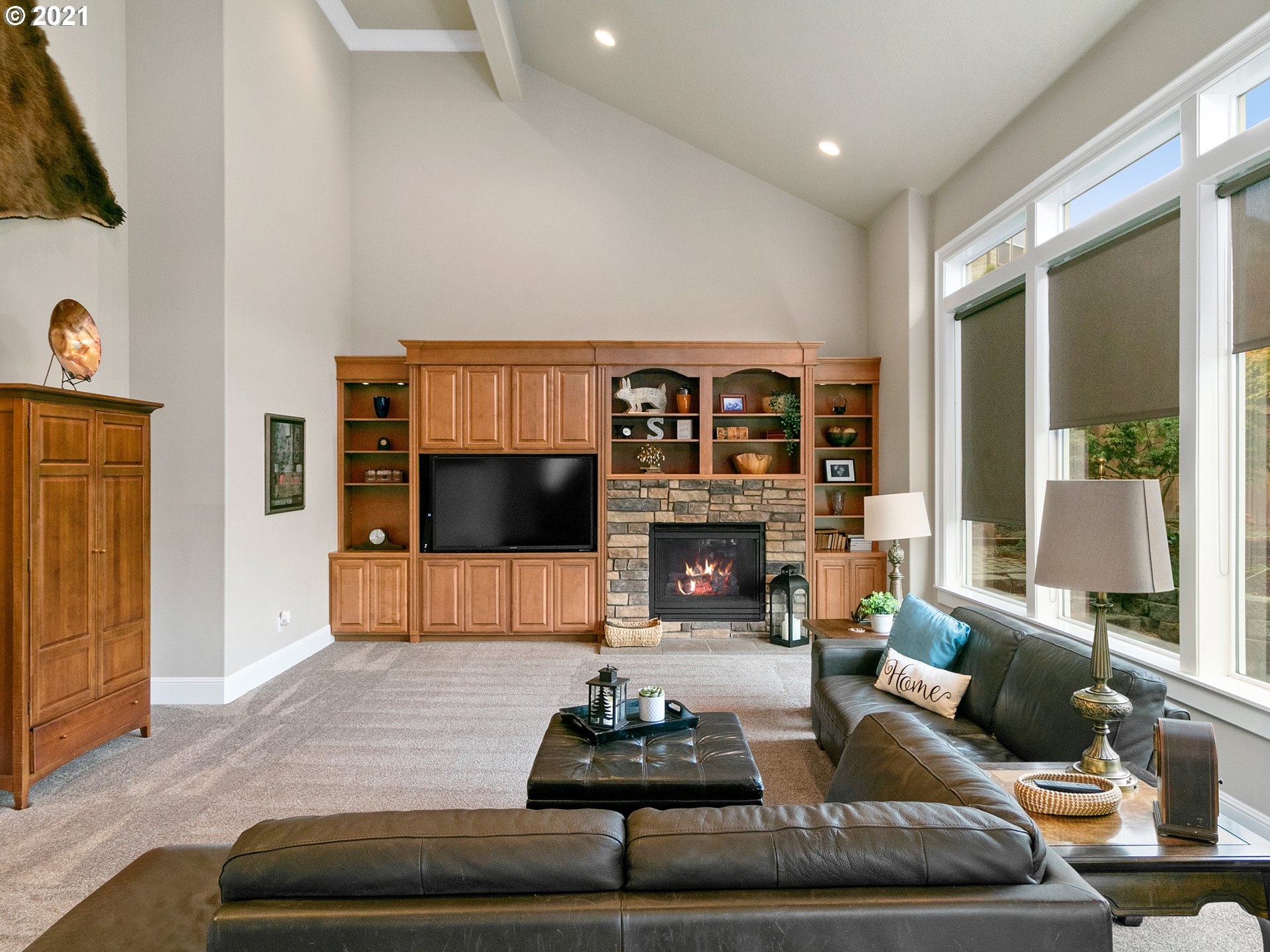 14741 Southeast Badger Creek Road Happy Valley, OR 97086 - Photo 16 of 32 a living room with furniture and a fireplace