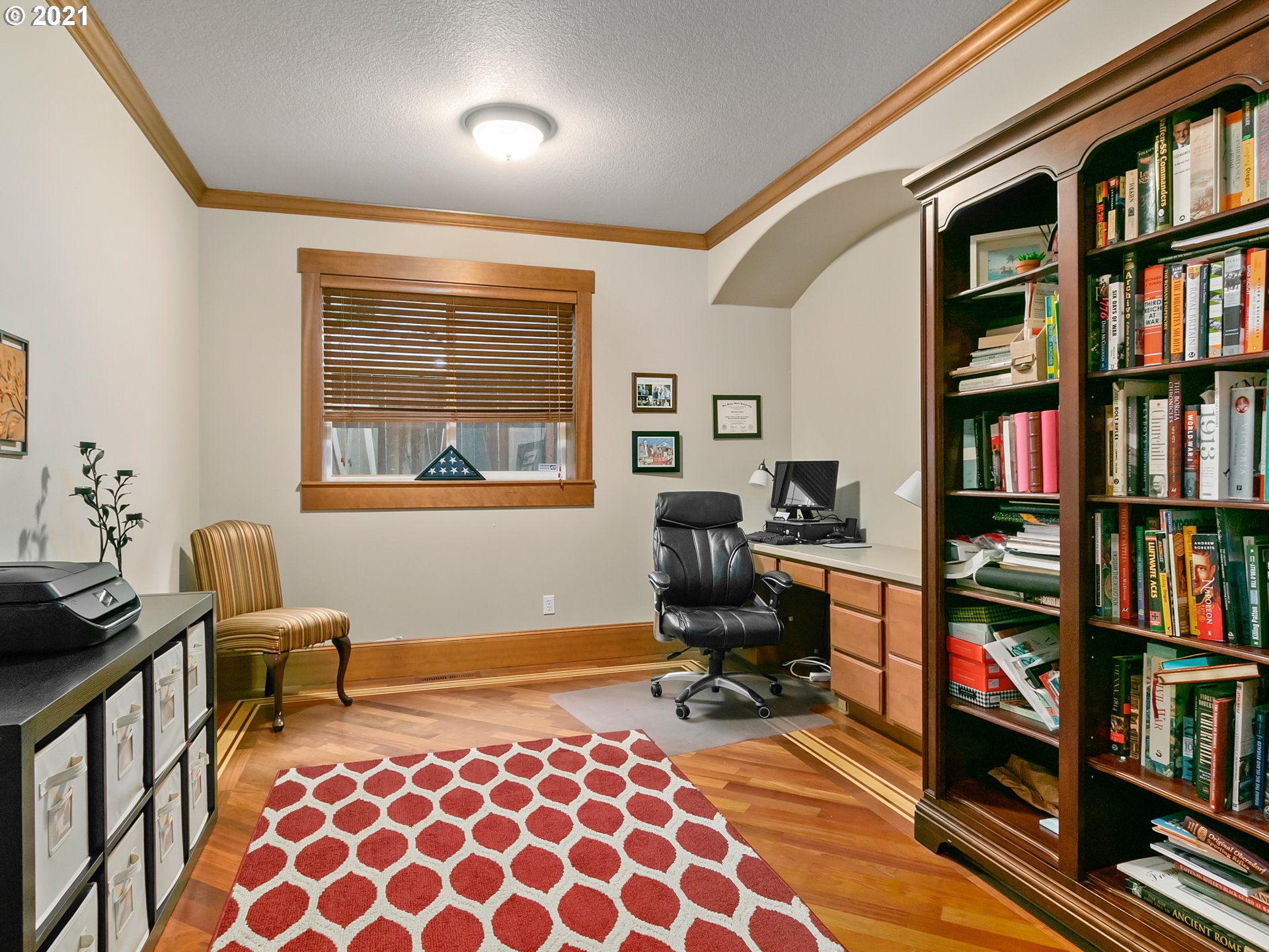 14741 Southeast Badger Creek Road Happy Valley, OR 97086 - Photo 19 of 32 a view of a workspace with furniture and a book shelf