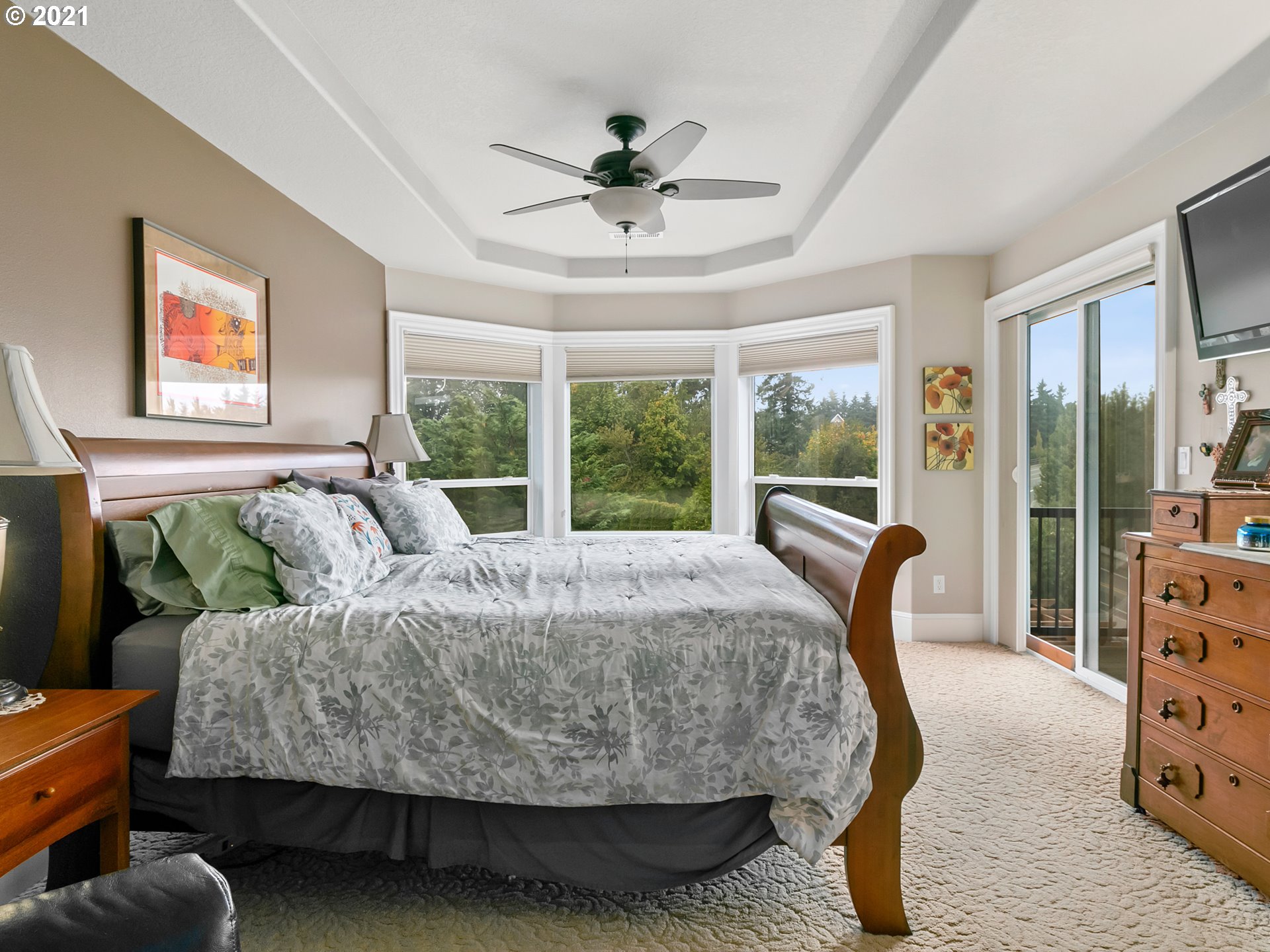 14741 Southeast Badger Creek Road Happy Valley, OR 97086 - Photo 20 of 32 a bedroom with a bed a window and a couch