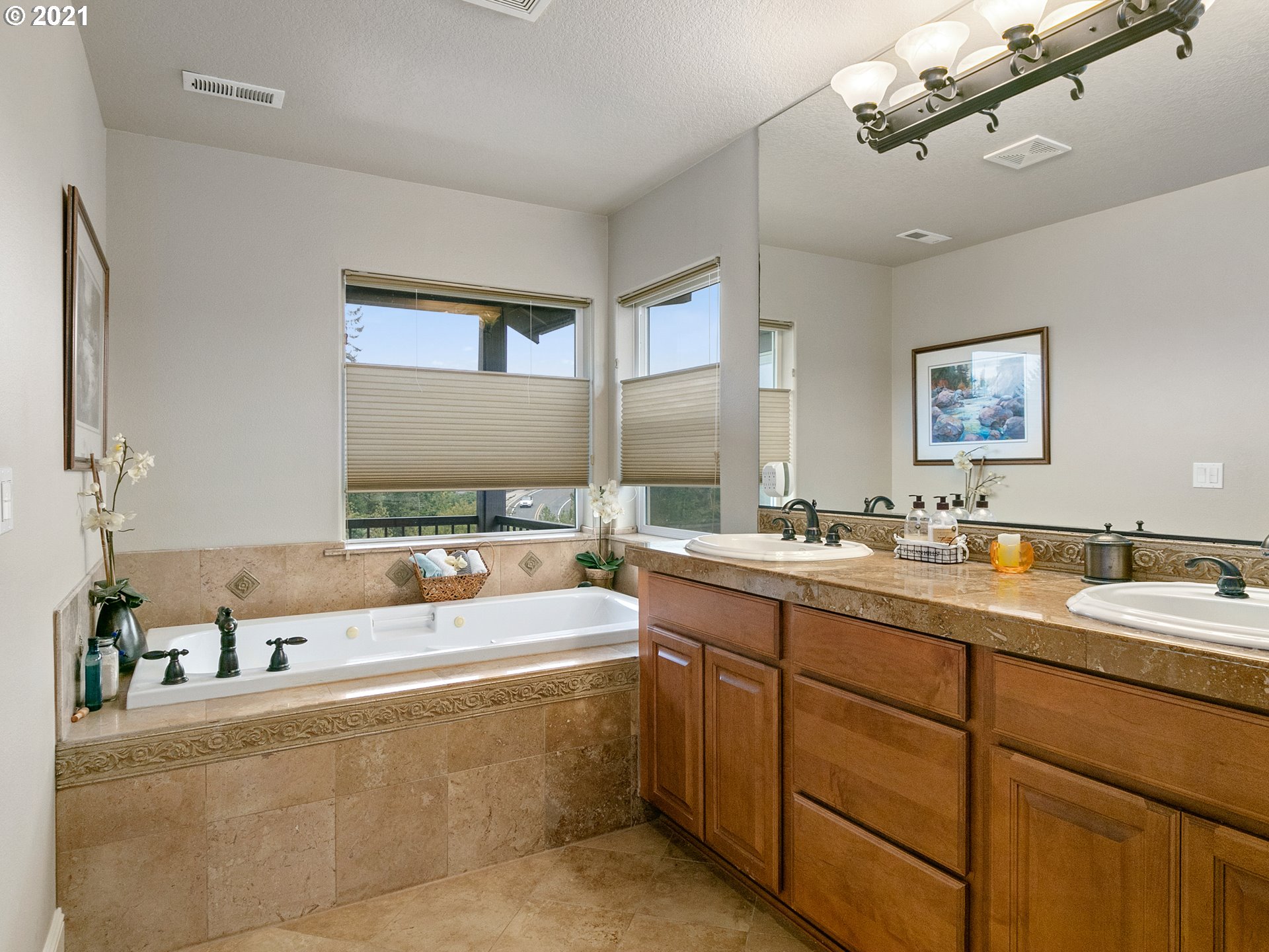 14741 Southeast Badger Creek Road Happy Valley, OR 97086 - Photo 22 of 32 a large spacious bathroom with a large tub and sink