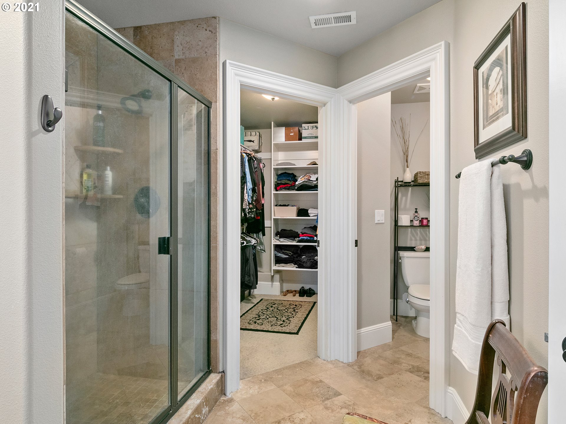 14741 Southeast Badger Creek Road Happy Valley, OR 97086 - Photo 23 of 32 a bathroom with a glass shower door and a sink