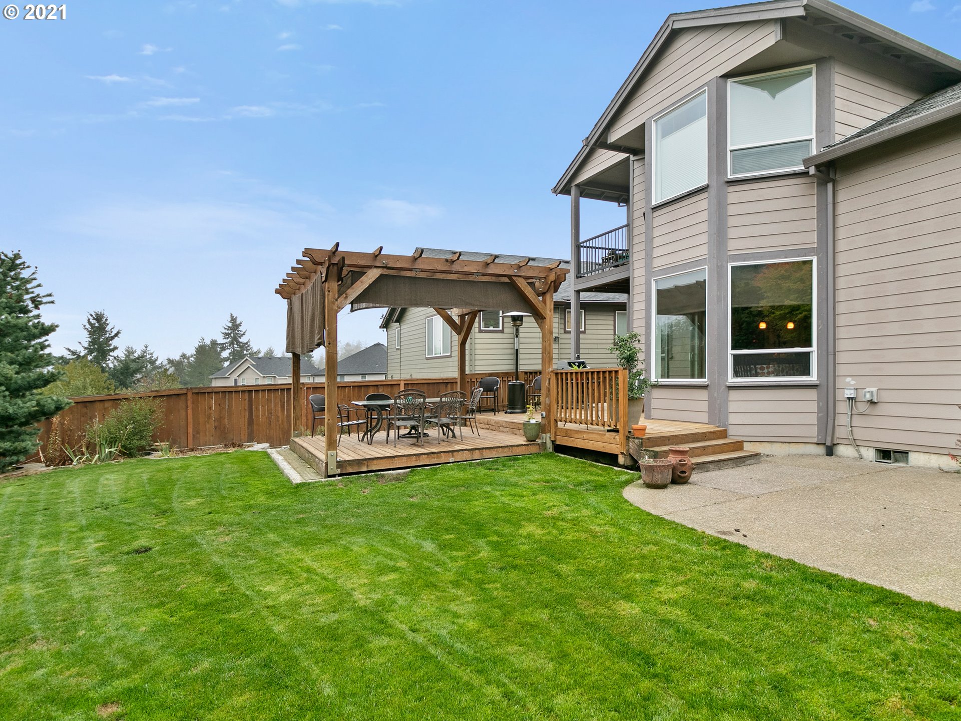 14741 Southeast Badger Creek Road Happy Valley, OR 97086 - Photo 29 of 32 a view of a house with backyard porch and garden