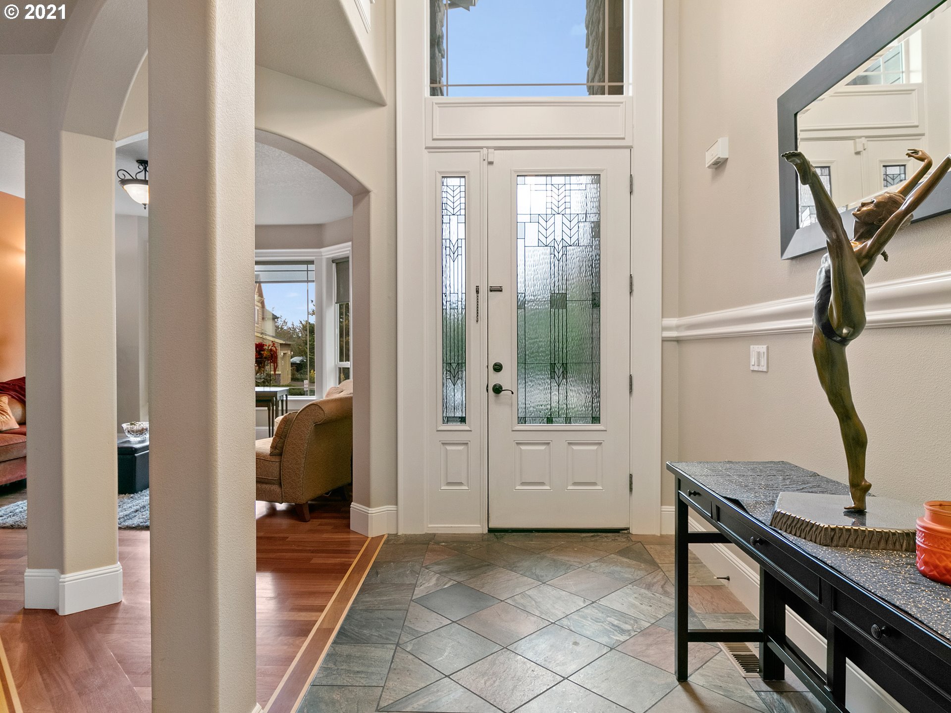 14741 Southeast Badger Creek Road Happy Valley, OR 97086 - Photo 5 of 32 a view of a livingroom with furniture and front door