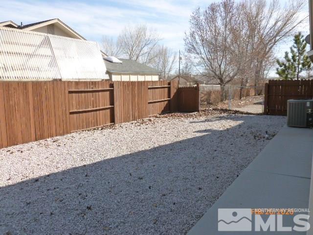 1850 Rice Road Fallon, NV 89406 - Photo 16 of 23 a backyard of a house with wooden fence
