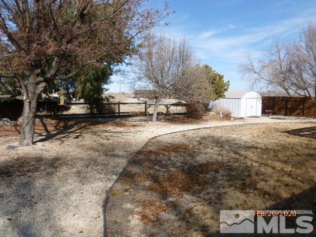 1850 Rice Road Fallon, NV 89406 - Photo 20 of 23 a view of a yard with wooden fence