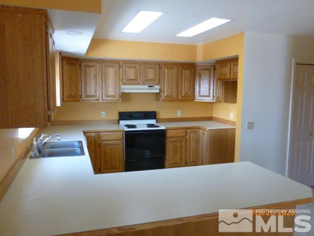 1850 Rice Road Fallon, NV 89406 - Photo 3 of 23 a kitchen with stainless steel appliances granite countertop a stove a sink and a refrigerator