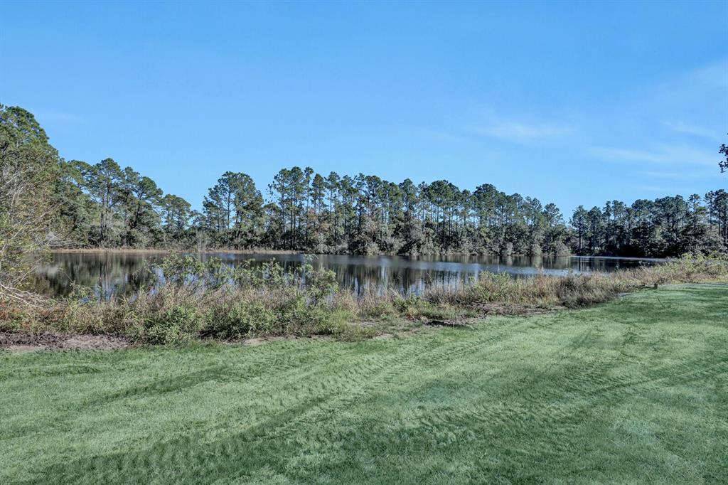 141 Woods Road San Mateo, FL 32187 - Photo 11 of 66 a view of lake with green space