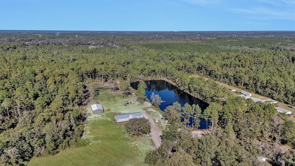 141 Woods Road San Mateo, FL 32187 - Photo 41 of 66 a view of balcony with wooden floor and city view