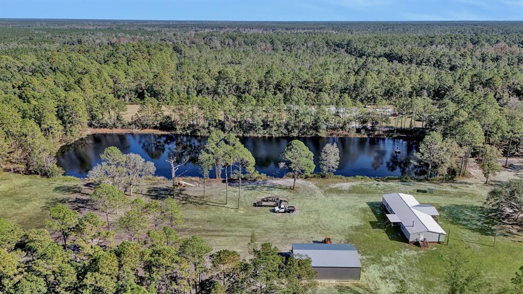141 Woods Road San Mateo, FL 32187 - Photo 45 of 66 an aerial view of a house with a yard
