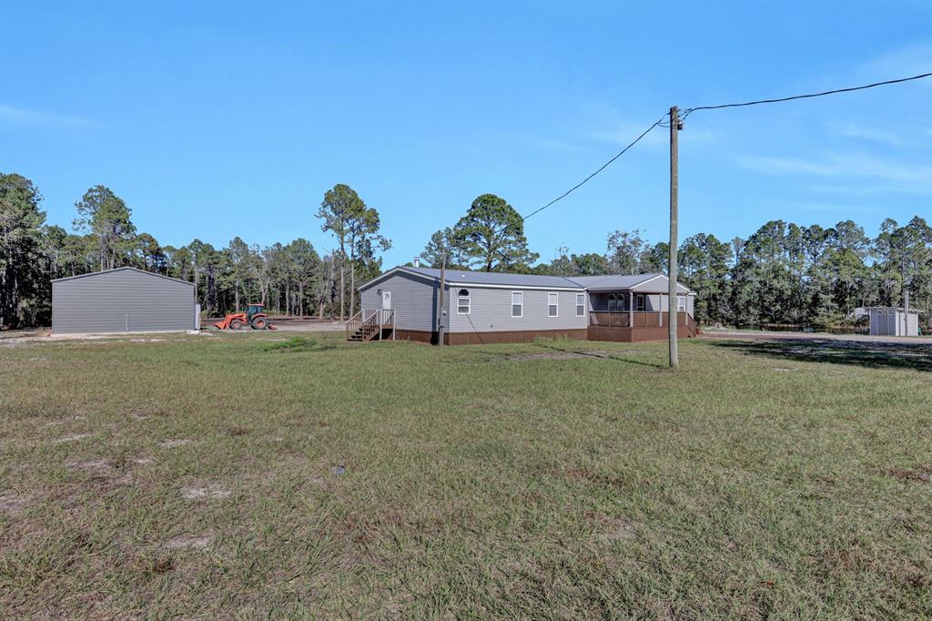 141 Woods Road San Mateo, FL 32187 - Photo 53 of 66 a view of a garden