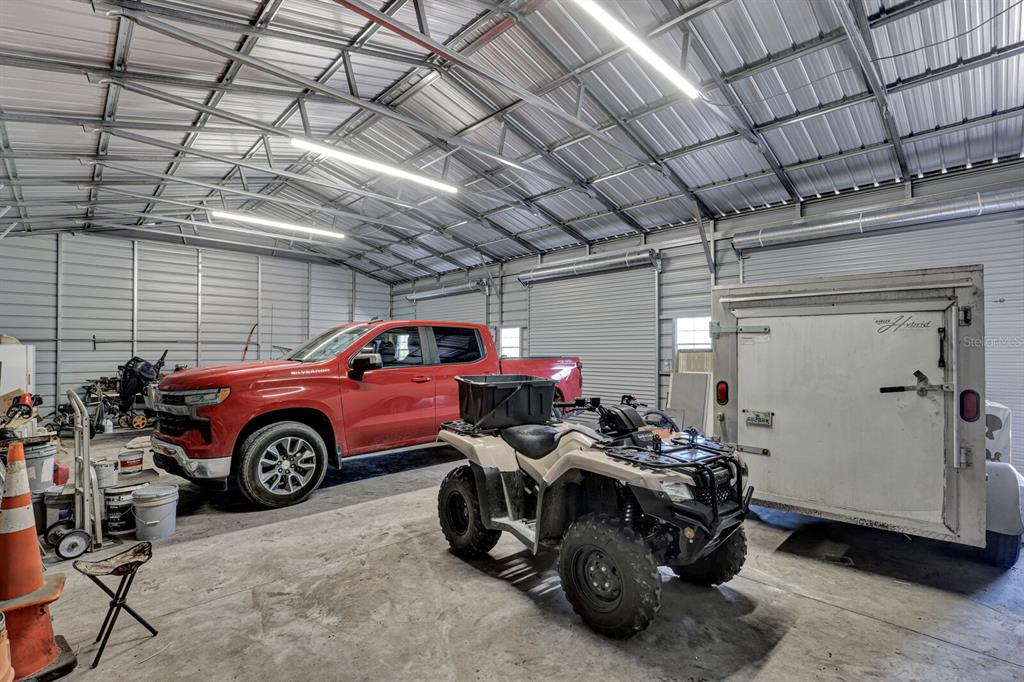 141 Woods Road San Mateo, FL 32187 - Photo 60 of 66 a view of a car in garage