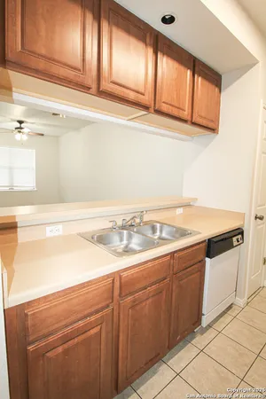 a kitchen with a sink cabinets and appliances