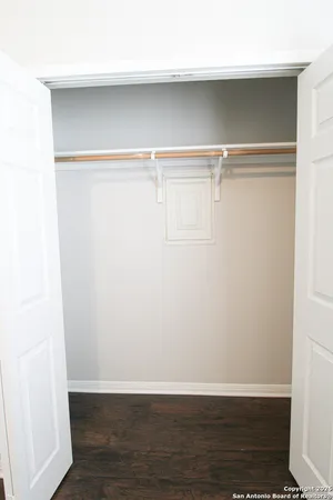 a view of an empty walk in closet