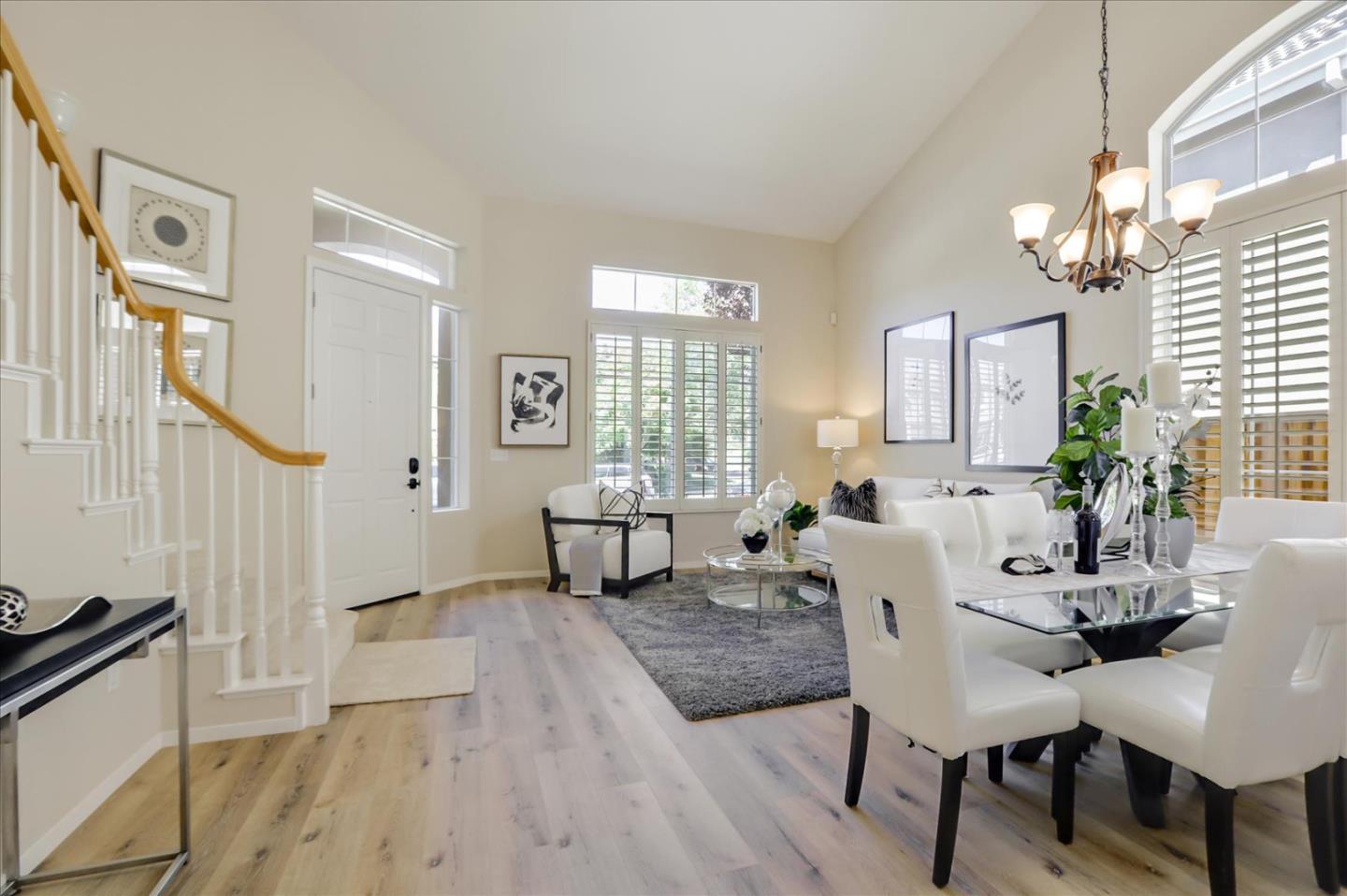 546 Esplanade Lane San Jose, CA 95138 - Photo 11 of 24 a living room with furniture a table and wooden floor