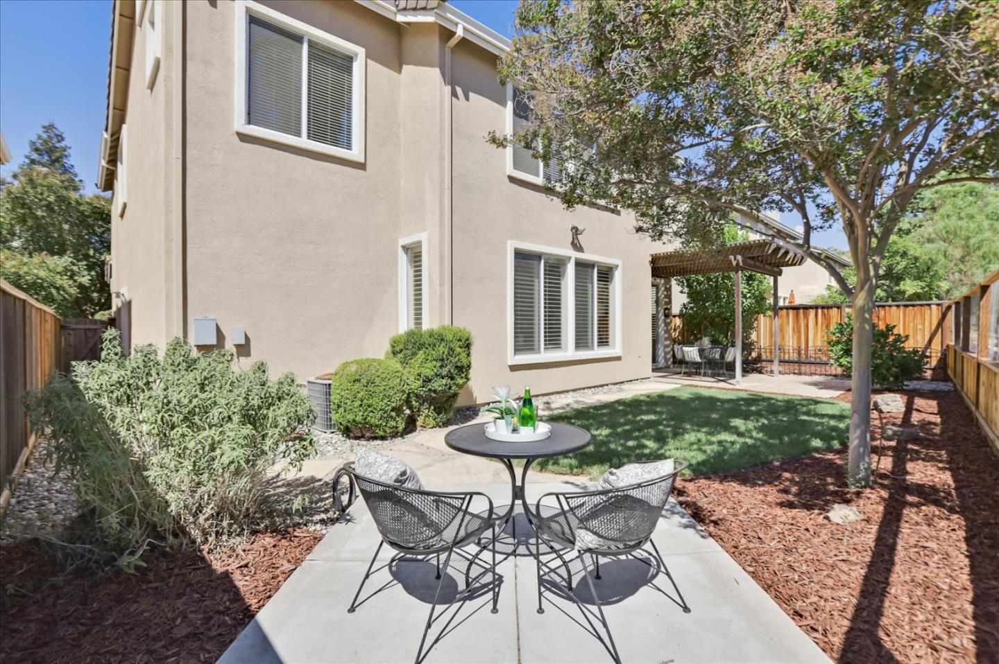 546 Esplanade Lane San Jose, CA 95138 - Photo 20 of 24 a view of a house with backyard and sitting area