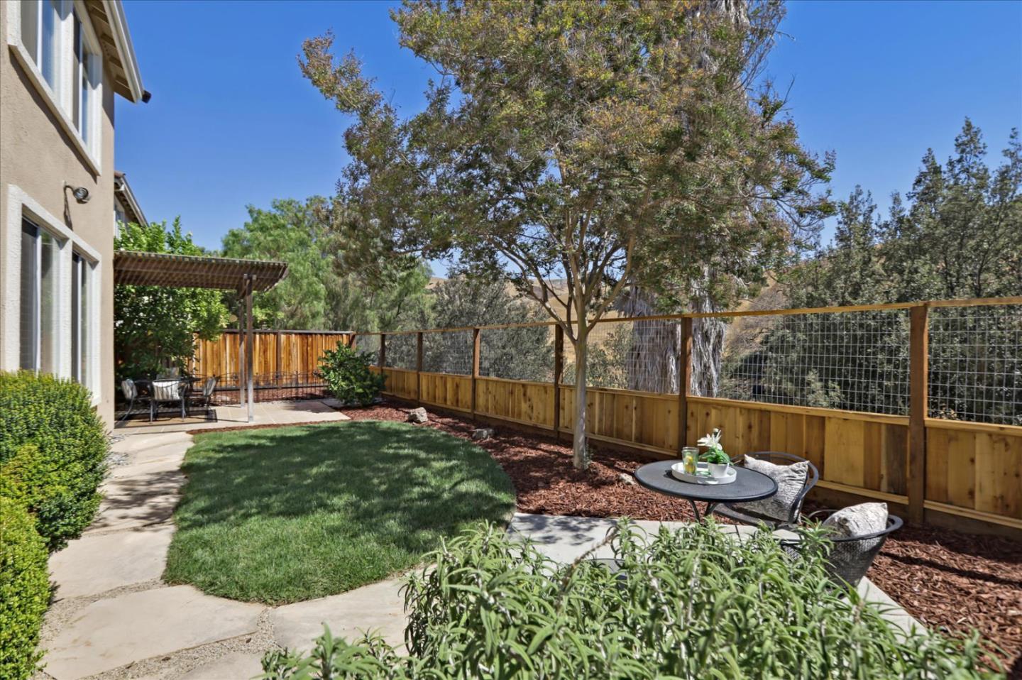 546 Esplanade Lane San Jose, CA 95138 - Photo 21 of 24 a view of a backyard with a patio
