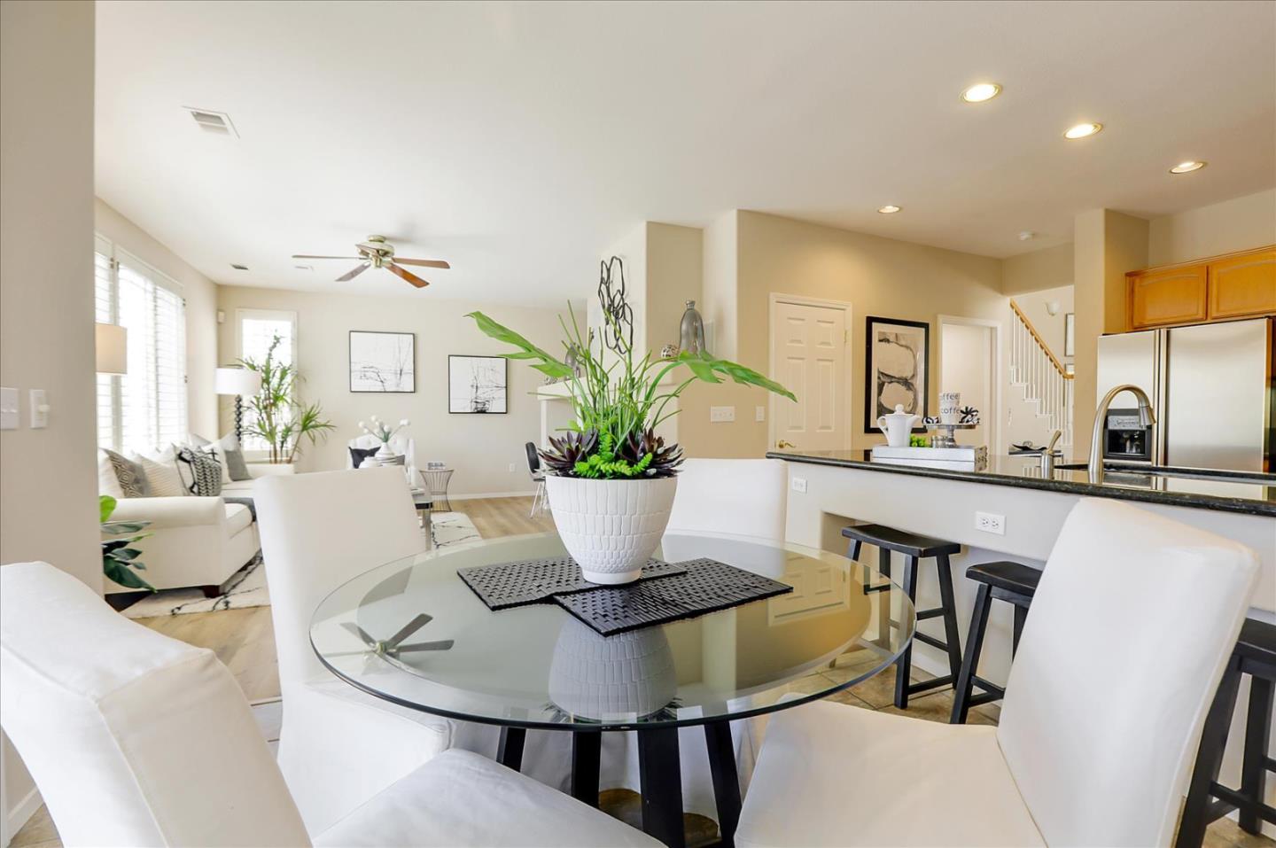 546 Esplanade Lane San Jose, CA 95138 - Photo 9 of 24 a dining room with furniture and wooden floor