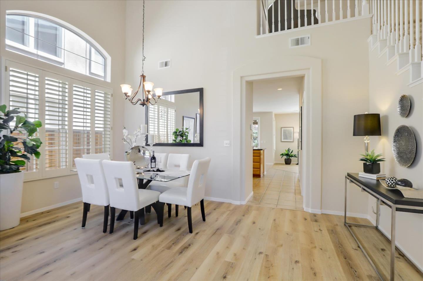 546 Esplanade Lane San Jose, CA 95138 - Photo 10 of 24 a view of a dining room with furniture and wooden floor