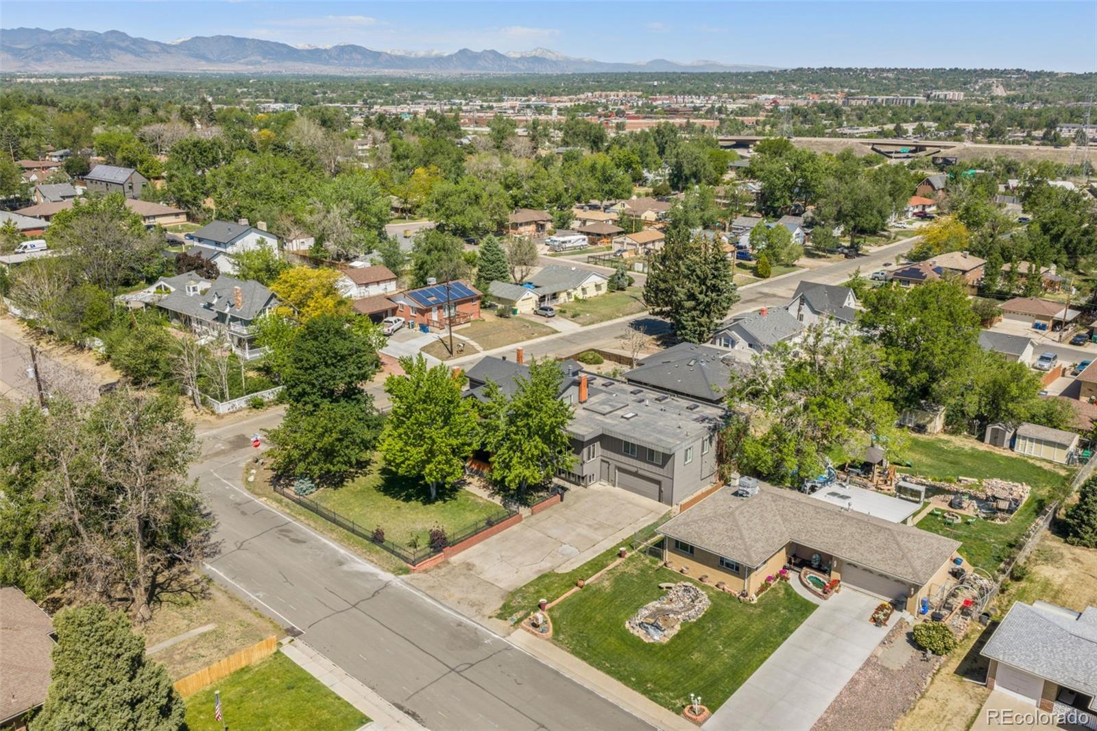6595 West 46th Place Wheat Ridge, CO 80033 - Photo 44 of 48 an aerial view of residential houses with outdoor space and trees