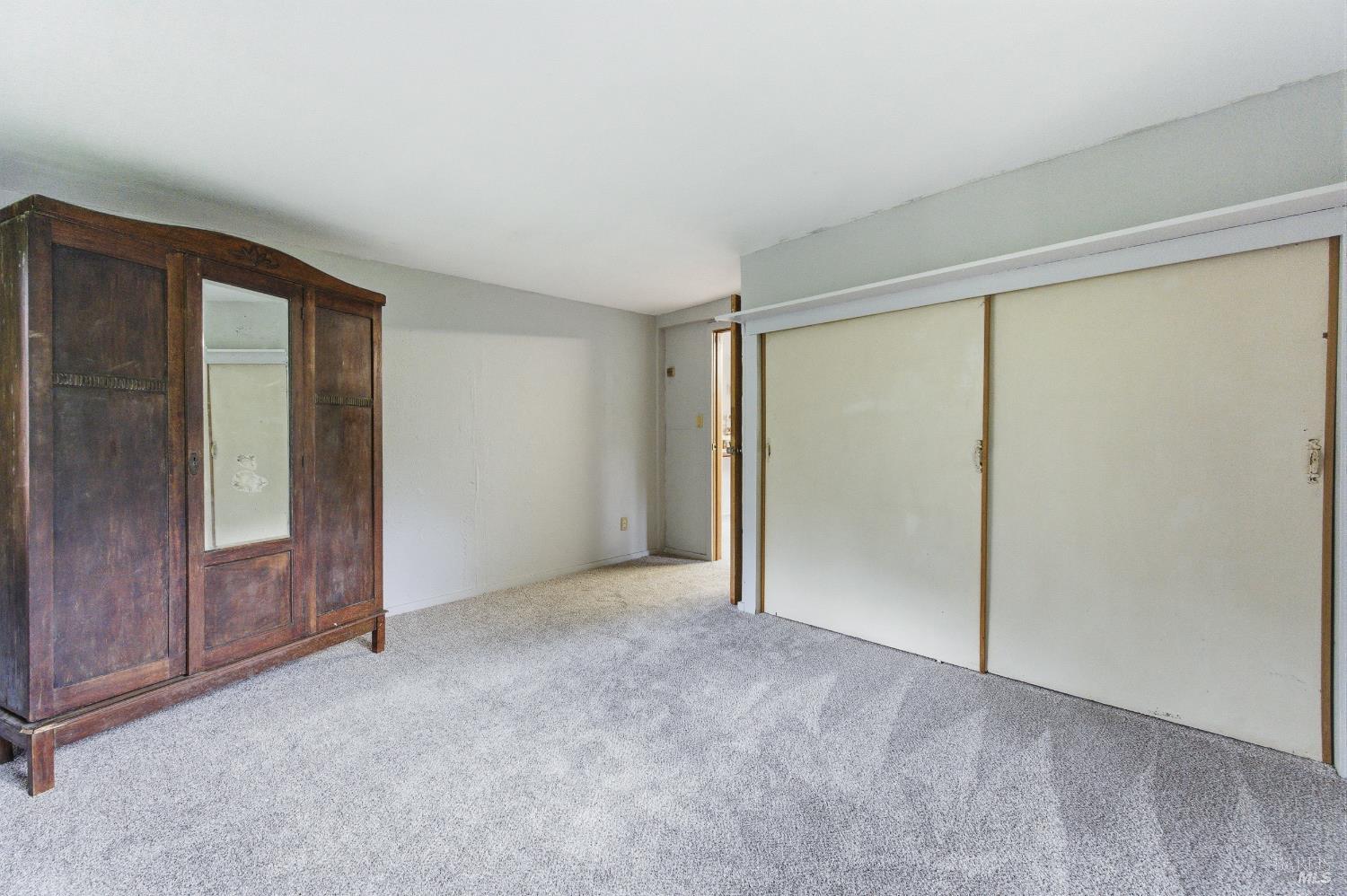 9489 Rio Vista Road Forestville, CA 95436 - Photo 20 of 32 an empty room with sliding glass door