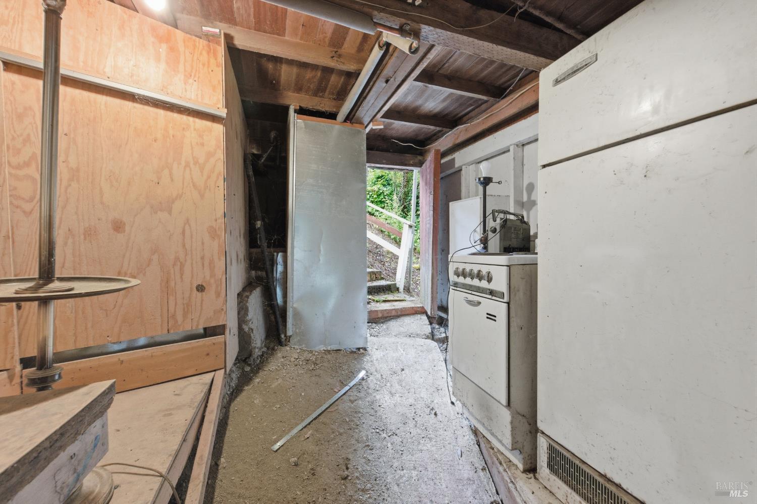 9489 Rio Vista Road Forestville, CA 95436 - Photo 26 of 32 a kitchen with a refrigerator and a stove