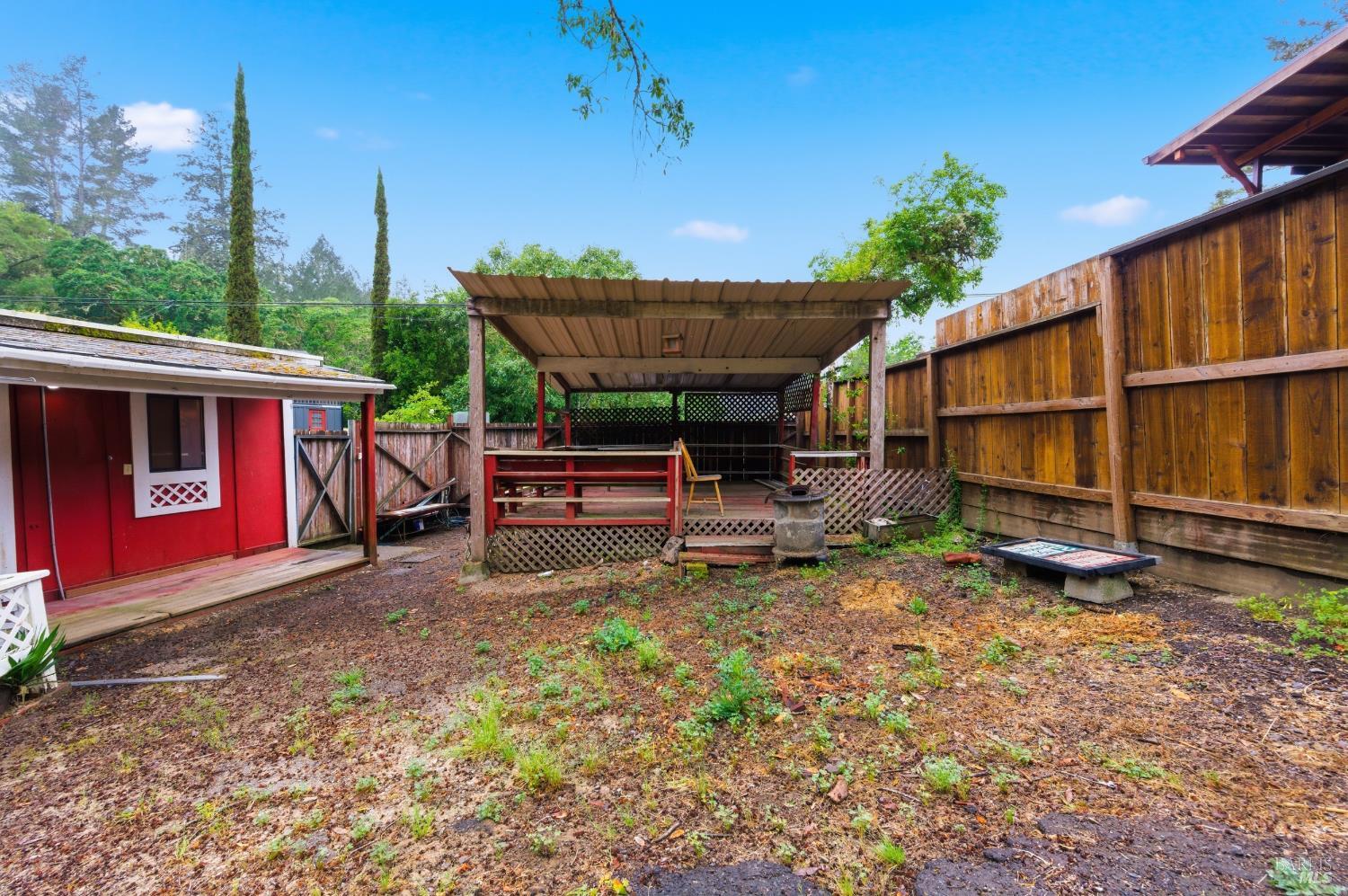 9489 Rio Vista Road Forestville, CA 95436 - Photo 8 of 32 a view of a backyard with a table and chairs